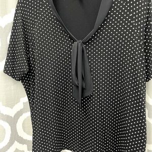 This top is by Talbots. Looks great on. Hang’s perfect, does not cling.